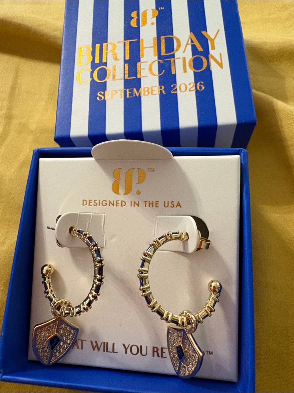bp Gold Hoop Earrings with Blue Crystal Shield Charms